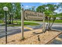 Exterior shot of the Yorktowne Estates community sign surrounded by landscaping and well-maintained grounds at 1601 Big Tree Rd # 1301, South Daytona, FL 32119
