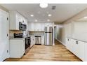 Bright kitchen features stainless steel appliances, new cabinets, and a functional design at 165 S Massachusetts Ave, Deland, FL 32724