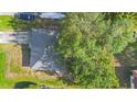 Aerial view of a home with a large tree providing shade to the property at 2110 3Rd Ave, Deland, FL 32724