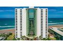 Striking direct exterior view of the condo building showing balcony views at 2425 S Atlantic Ave # 1202A, Daytona Beach Shores, FL 32118