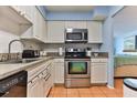 Efficient kitchen featuring stainless steel appliances and ample countertop space at 2800 N Atlantic Ave # 206, Daytona Beach, FL 32118