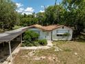 Charming single-story home with a clean white exterior and a cozy, inviting entrance at 29505 North, Paisley, FL 32767