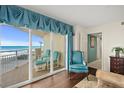 Relaxing room that leads to a balcony with ocean views at 2967 S Atlantic Ave # 202, Daytona Beach Shores, FL 32118