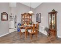 Inviting dining room with wood floors, cabinets, and a view of the kitchen at 3001 Inca Ct, Deltona, FL 32738
