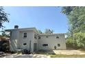 Back facade of the two-story house with neutral color at 404 Brentwood Ave, Deland, FL 32724