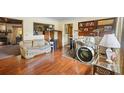 Cozy living room with hardwood floors, fireplace, and a drum set at 409 S Sparkman Ave, Orange City, FL 32763