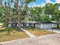 Charming single-story home with a well-maintained lawn, front-facing garage, and inviting walkway at 511 Doctors Dr, Oviedo, FL 32765