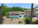 Expansive backyard featuring a pool, patio, and lush landscaping, creating a private outdoor oasis at 5496 S Nova Rd, Port Orange, FL 32127