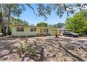 Single-story home with a cozy feel, natural light, and mature landscaping at 632 Tarragona Way, Daytona Beach, FL 32114