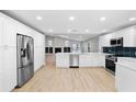 Spacious kitchen with modern stainless steel appliances, stylish countertops, and ample cabinet space at 9720 Fairway Cir, Leesburg, FL 34788