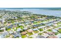 Aerial view of a residential neighborhood with a view of a lake at 114 Ocean Aire N Ter, Ormond Beach, FL 32176