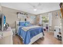 Cozy bedroom featuring a plush bed, ample natural light, and stylish decor at 1191 Tracy Dr, Port Orange, FL 32129