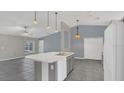 Spacious kitchen with center island and stainless appliances offers style and function at 1194 Balfour Dr, Deltona, FL 32725