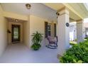 Charming front porch with outdoor seating and lush landscaping; perfect spot for relaxing at 1386 Brayford Pt, Deland, FL 32724