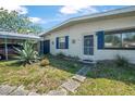 Well-maintained single-story home with a carport and desert-friendly plants in the front yard at 1608 Raleigh Ave, Daytona Beach, FL 32117