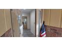Bright entryway with brick accents, tiled flooring, and a glimpse of the home's interior at 1621 Anniston Ave, Daytona Beach, FL 32117