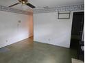 A glimpse into the living room featuring outdated decor and fixtures awaiting modernization and personalization at 16880 Se 63Rd Ln, Ocklawaha, FL 32179