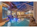 Enjoy this large screened-in pool area with a unique rock feature, creating a private backyard oasis for relaxation and entertainment at 18 Foxfords, Ormond Beach, FL 32174