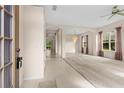 Inviting foyer with tile flooring that flows into the open living space with arched doorways at 200 Gala Cir, Daytona Beach, FL 32124