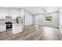 Bright living room and kitchen area with stainless steel appliances and modern finishes at 2379 8Th Ave, Deland, FL 32724