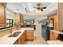 Well-equipped kitchen with stainless steel appliances, light wood cabinetry, and tiled flooring at 25 Pine Glen Dr, Debary, FL 32713