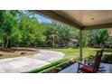 Cozy patio overlooking the backyard, perfect for relaxing and enjoying the peaceful surroundings at 2953 Sled Rd, Christmas, FL 32709