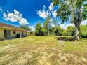 Expansive backyard offers plenty of room for outdoor activities and relaxation under the sky at 2978 Greynolds St, Deltona, FL 32738