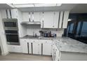 Bright kitchen featuring stainless steel appliances and sleek countertops at 3003 S Atlantic Ave # 17A1, Daytona Beach Shores, FL 32118