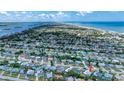 Wide aerial view showcasing the property's location relative to the ocean and surrounding coastal community at 31 River Shore Dr, Ormond Beach, FL 32176
