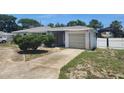 Single story home with a one car garage and a driveway needing repair at 327 Frances Ter, Daytona Beach, FL 32118