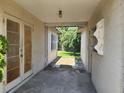 Covered passageway leads from the garage into the backyard with brick flooring at 327 Frances Ter, Daytona Beach, FL 32118