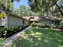 Beautiful front exterior showcasing lush landscaping and charming architectural details at 37 Meadowwood Trl, Deland, FL 32724