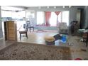 Open-concept living room featuring natural light, tile floors, and plenty of space at 3788 Fir Ct, Ormond Beach, FL 32174