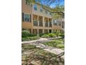 Charming townhome with a well-maintained front yard and inviting entryway, perfect for modern living at 4297 Regal Town Ln, Lake Mary, FL 32746