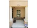 Charming townhouse porch with neutral pillars, stone accent wall and decorative wreath at 4297 Regal Town Ln, Lake Mary, FL 32746