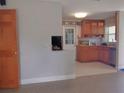 The kitchen has a tiled floor, wooden cabinets, and stainless steel appliances at 4830 Kempston Dr, Orlando, FL 32812