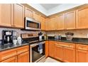 Kitchen featuring granite countertops, tile backsplash and stainless-steel appliances at 5300 S Atlantic Ave # 12-403, New Smyrna Beach, FL 32169