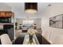 Elegant dining area with modern chandelier and open floor plan at 541 Northwestern Ave, Altamonte Springs, FL 32714