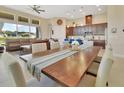 Dining area showcases a large table, open floorplan and abundant natural light at 6254 Woodhaven Village Dr, Port Orange, FL 32128