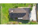 Aerial view of home showing roof, lawn, and surrounding landscaping at 701 N Tuxedo Ave, Deland, FL 32724
