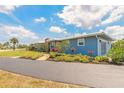 Charming single-story home featuring a side entry two-car garage and gorgeous landscaping at 1032 Bel Aire Dr, Daytona Beach, FL 32118