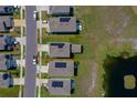 A beautiful aerial view of the property with a defined lot line and a serene pond nearby at 1183 Cabot Cliffs Dr, Daytona Beach, FL 32124