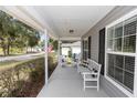 Welcoming front porch with comfortable seating and charming details at 1326 13Th St, Orange City, FL 32763
