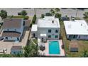 Aerial view of backyard with pool and patio at 145 S Peninsula Dr, Daytona Beach, FL 32118