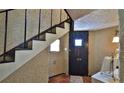 Cozy entryway with stairs and unique wall texture at 145 S Peninsula Dr, Daytona Beach, FL 32118