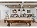 Game room area with a custom pool table and seating at 160 Point O Woods Dr, Daytona Beach, FL 32114