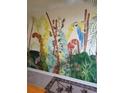This hallway features a colorful mural, adding an artistic touch to the living space at 1640 Juno Trl # 103F, Astor, FL 32102