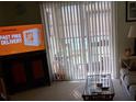 Comfortable living room area with sliding glass doors opening to outdoor space at 1640 Juno Trl # 103F, Astor, FL 32102