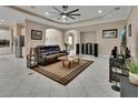 Open-concept living room with neutral walls, tile floors, recessed lights, and a view of the kitchen at 171 Birchmont Dr, Deland, FL 32724