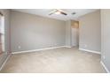 Bright bedroom with neutral carpet, ceiling fan, and closet space at 201 Dyson Dr, Deland, FL 32724